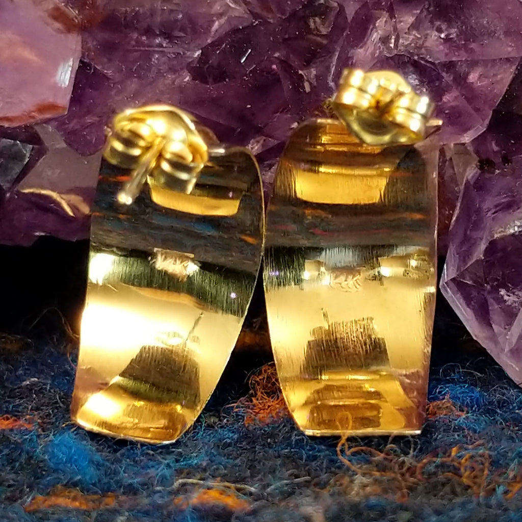 Pair of earrings with gold stamp found on the back.