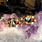 Zuni hoop earrings with multi-stone inlay in gold.