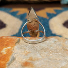 Handcrafted sterling silver Zuni multistone navette ring by Cleo Kallestewa, featuring a geometric inlay; underside view.