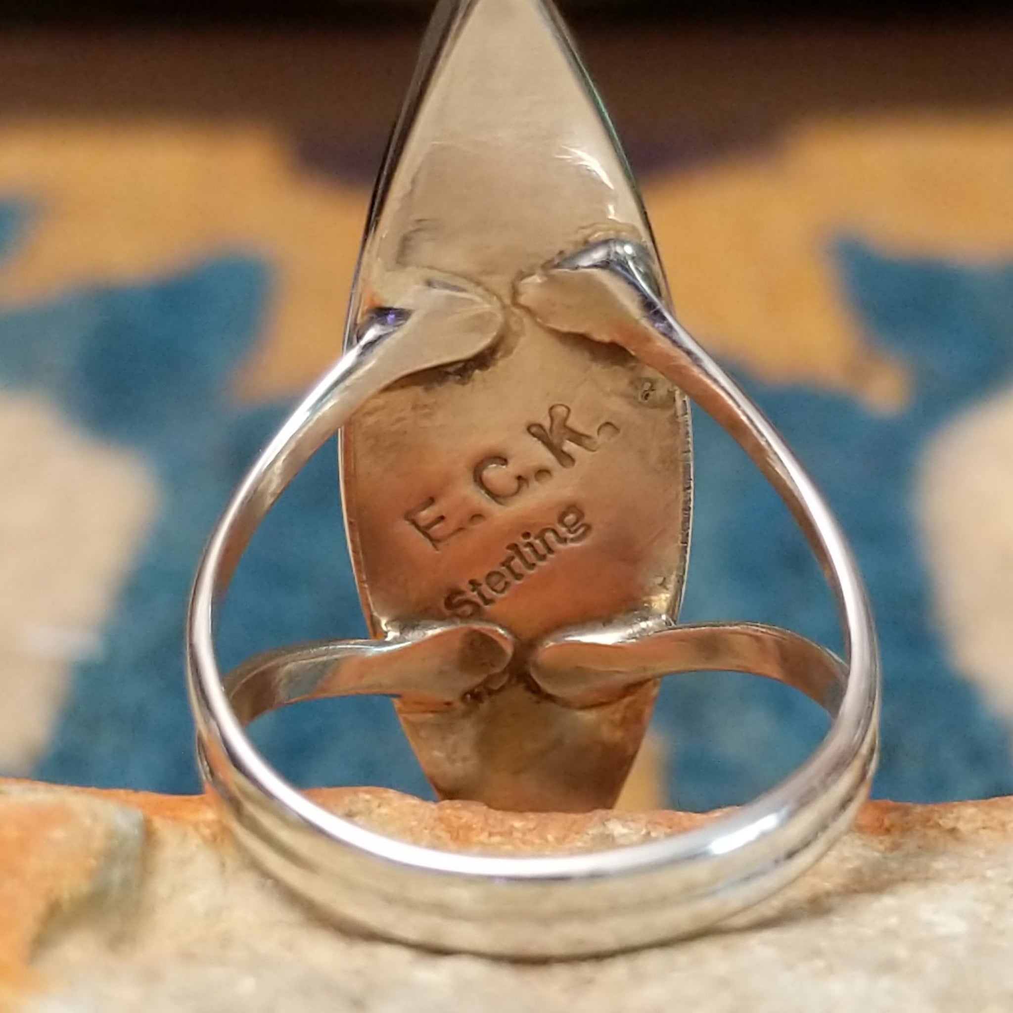 Handcrafted sterling silver Zuni multistone navette ring by Cleo Kallestewa, featuring a geometric inlay; artisan and Sterling Silver stamp.
