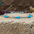 Sterling Silver link bracelet with turquoise stones 