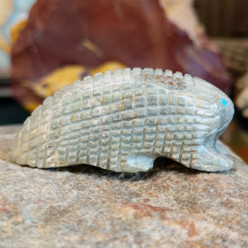 Picasso marble carved into a porcupine fetish with intricate etched details.