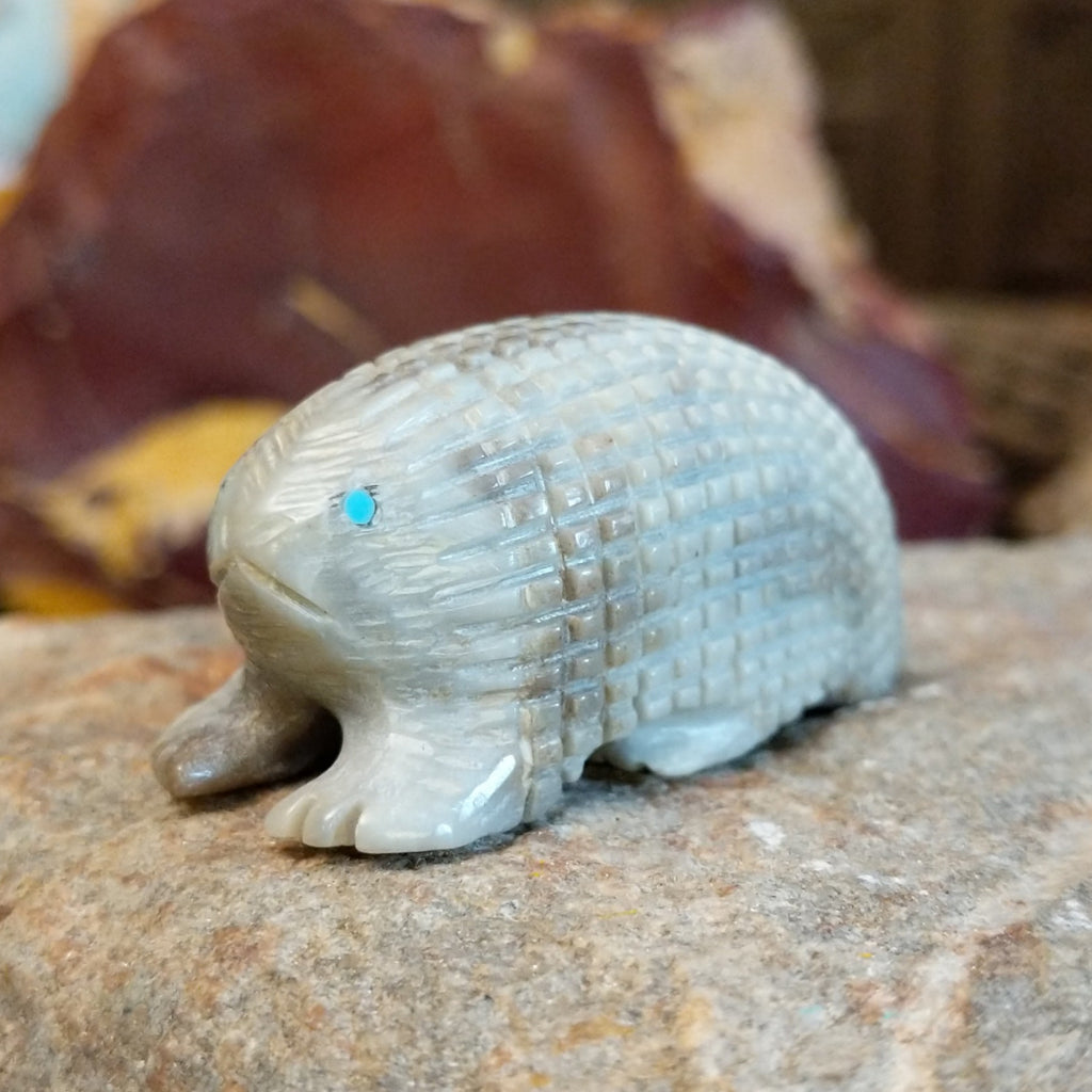 Picasso marble carved into a porcupine fetish with intricate etched details.