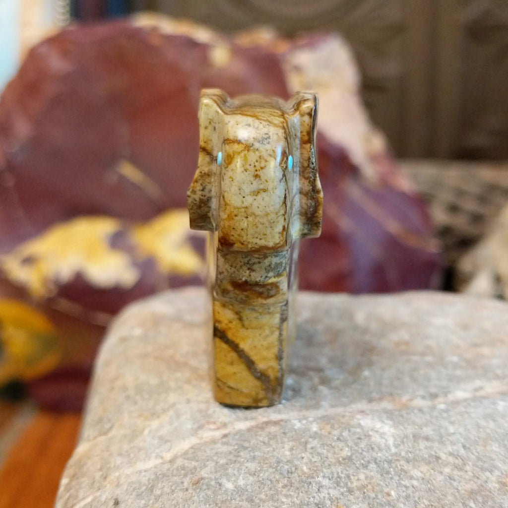 Picasso marble carved into a ram with etched motifs on the body.