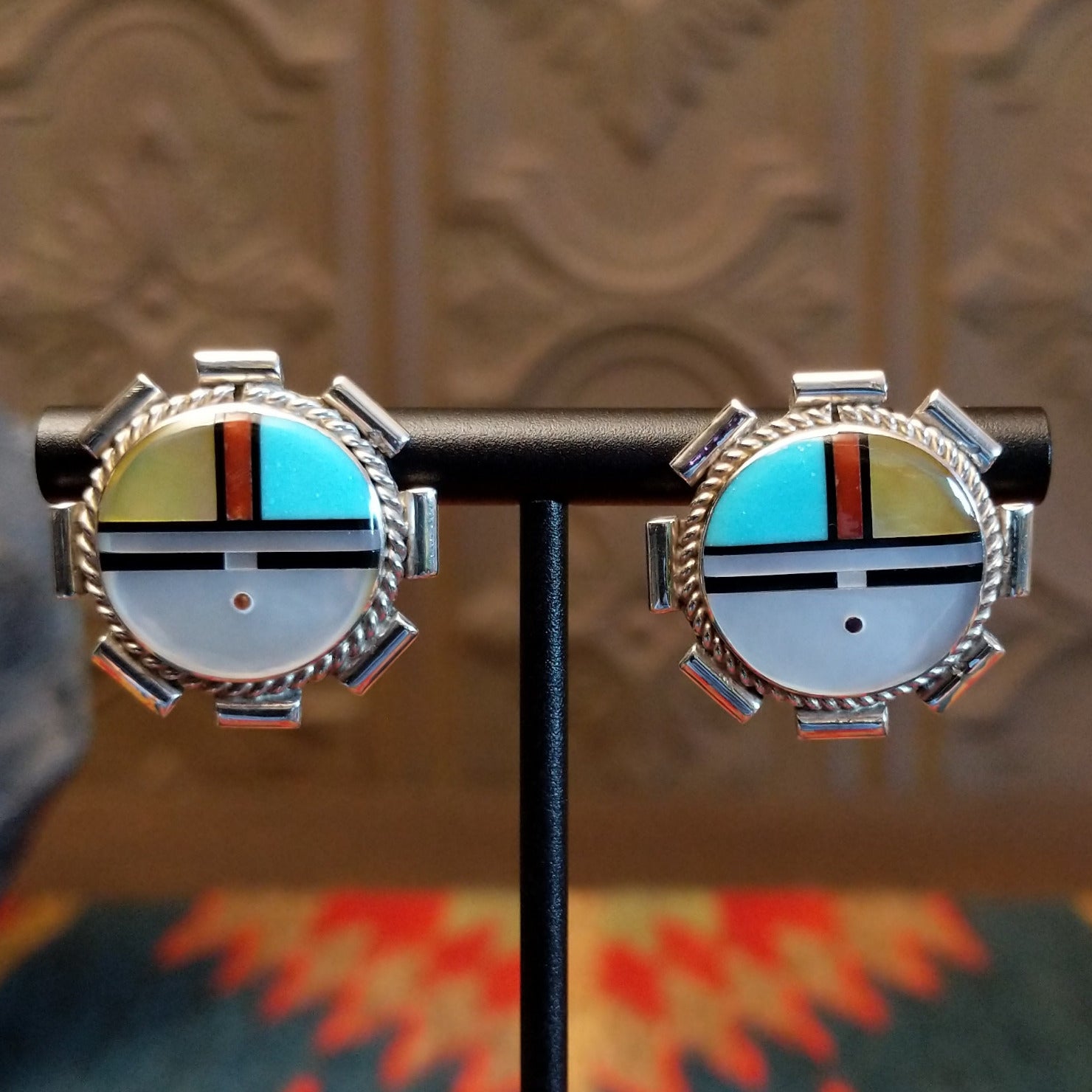 Sterling silver sunface earrings with multistone inlay and unique silverwork.