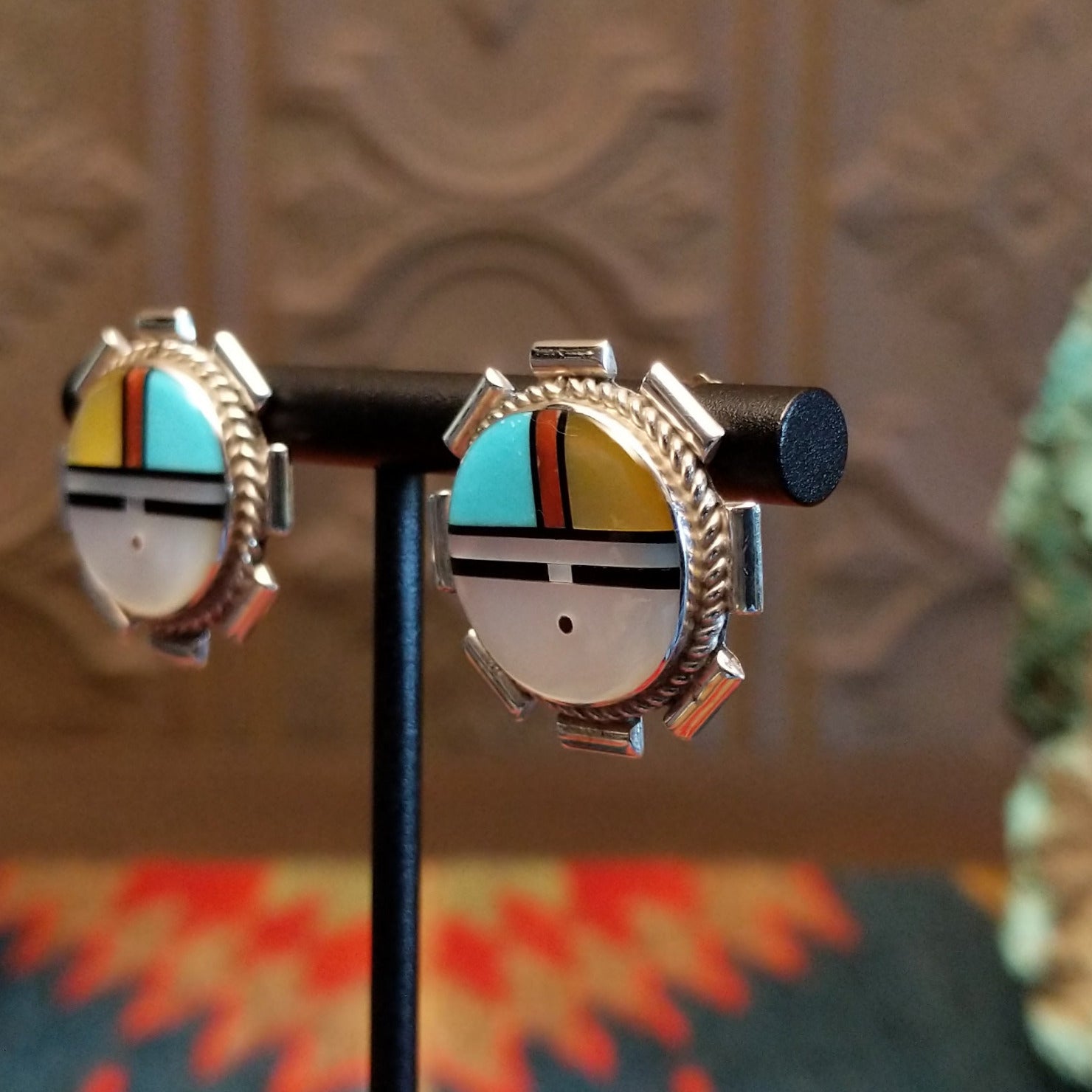 Sterling silver sunface earrings with multistone inlay and unique silverwork.