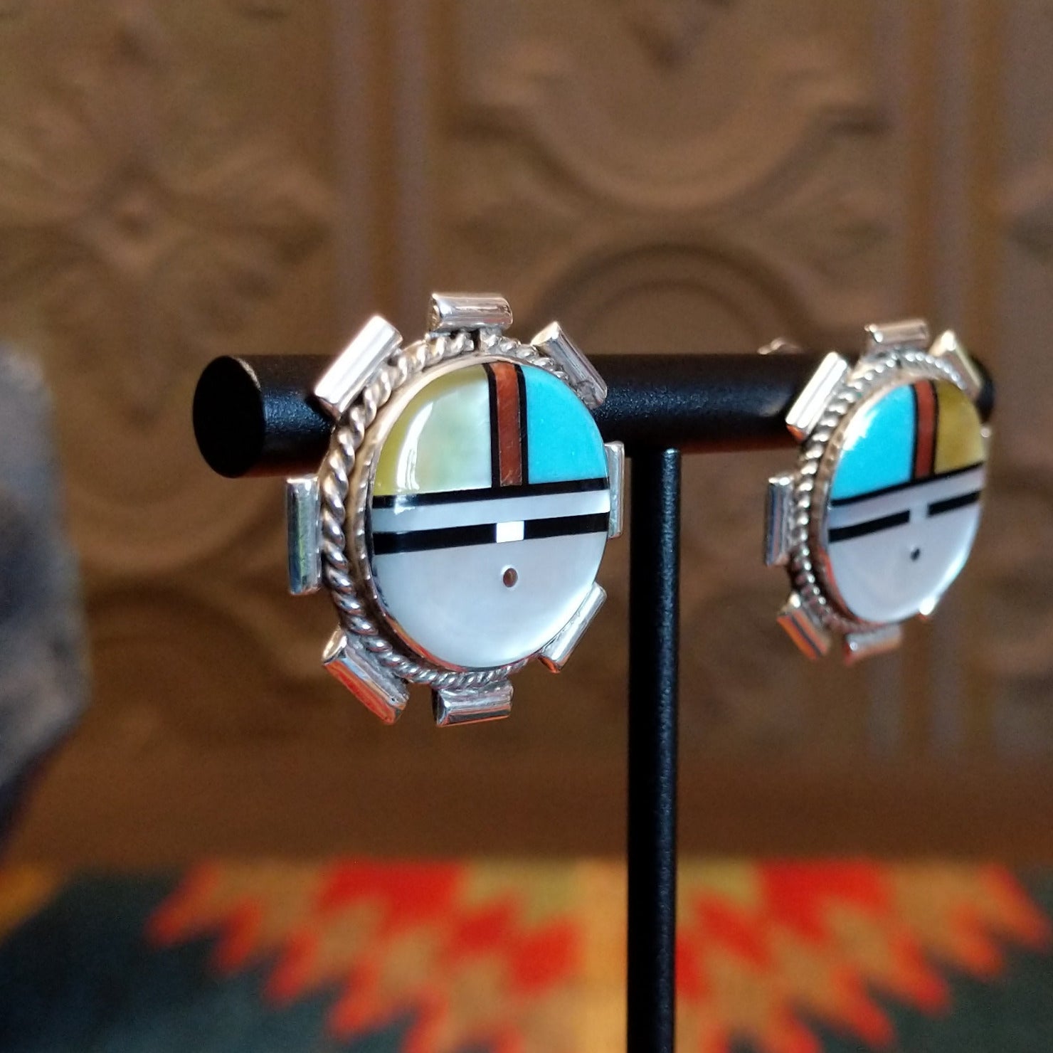 Sterling silver sunface earrings with multistone inlay and unique silverwork.