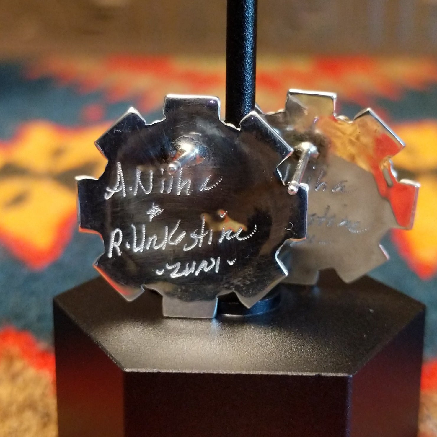 Close-up of the artisan's stamped signature.