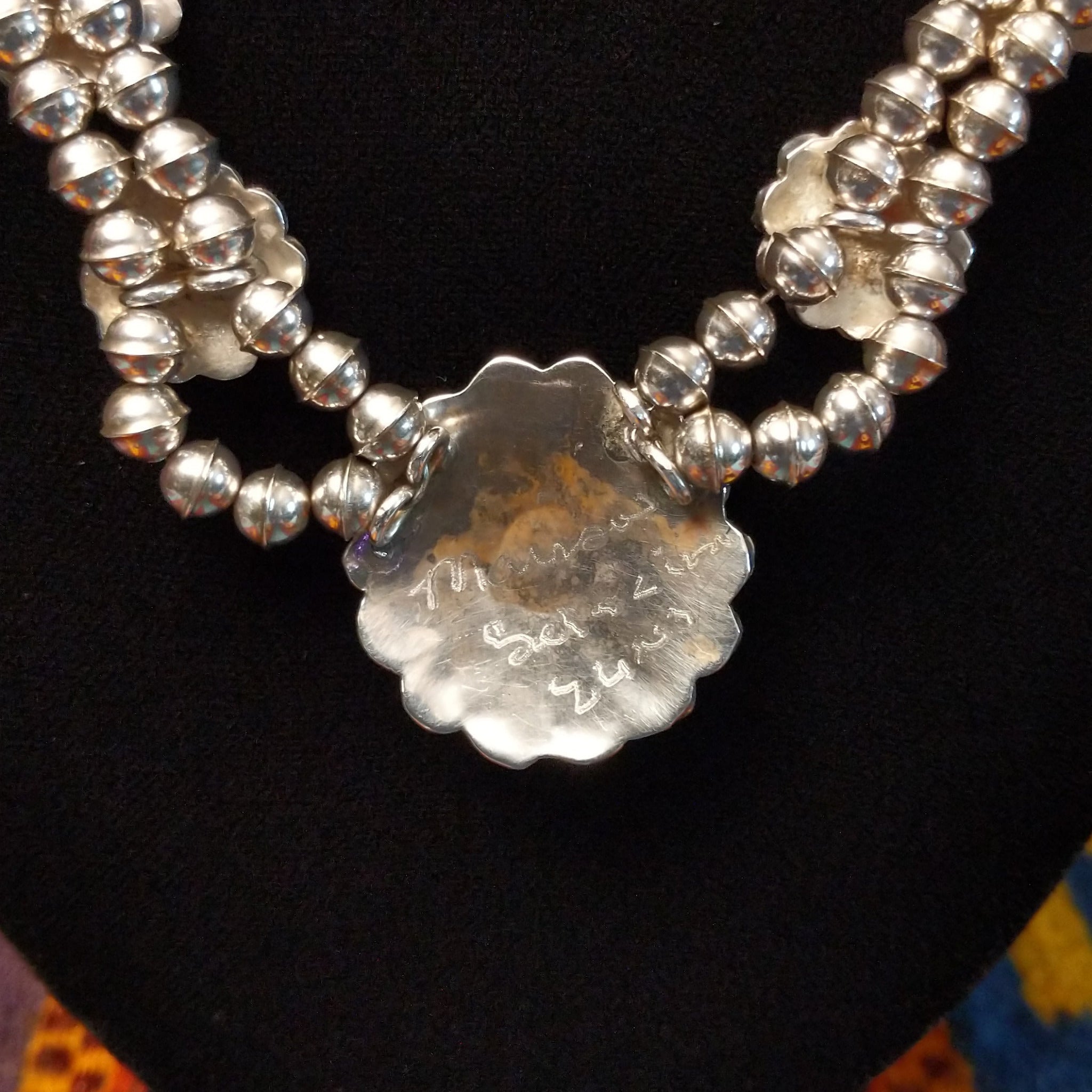 Artisan and Sterling Silver engraving.