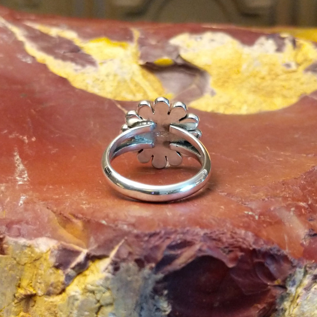 Detailed Sunface motif as the sterling silver ring's centerpiece.