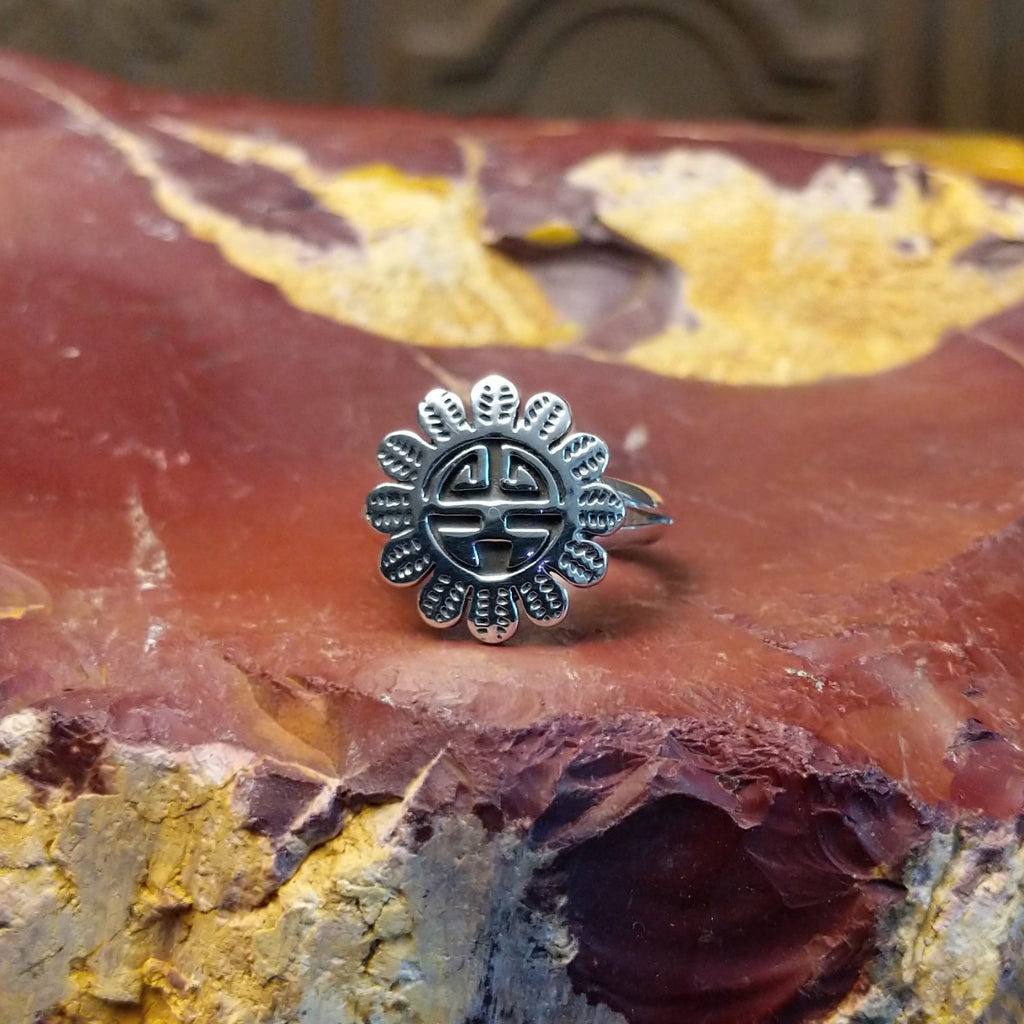 Detailed Sunface motif as the sterling silver ring's centerpiece.