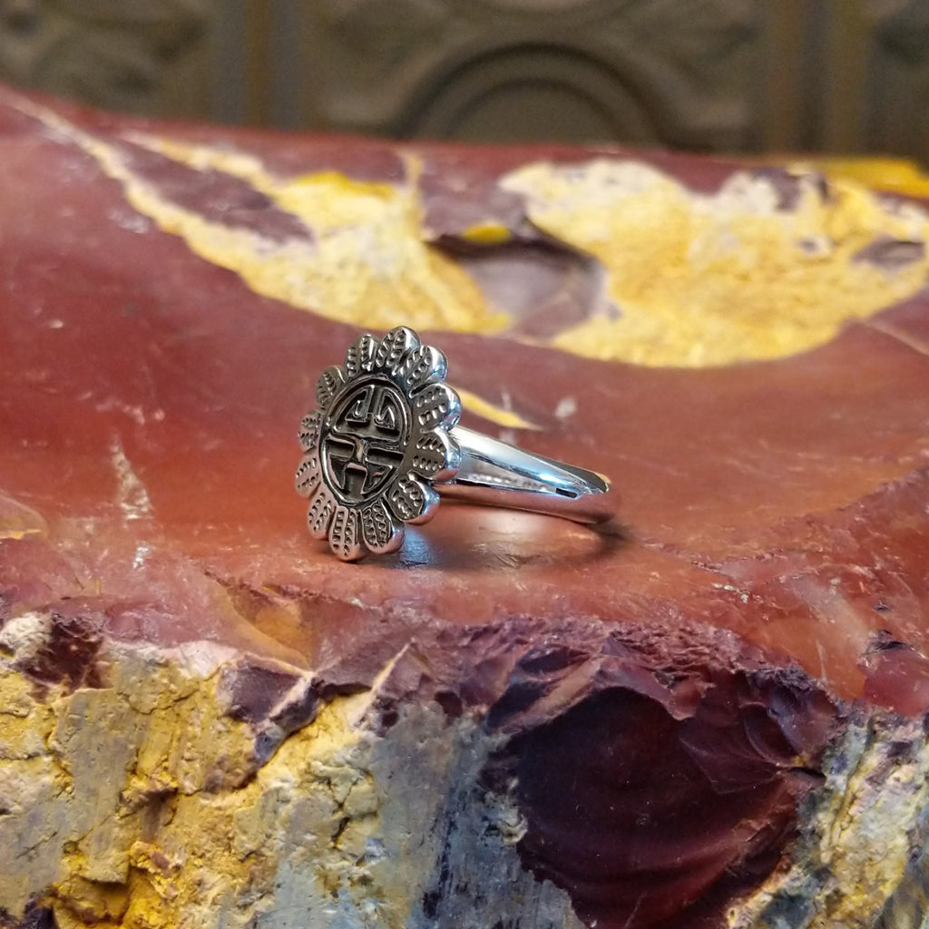Detailed Sunface motif as the sterling silver ring's centerpiece.