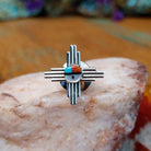 Sterling silver Zuni tie tack with sun symbol-inspired design and multistone center.