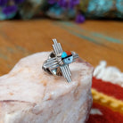 Sterling silver Zuni tie tack with sun symbol-inspired design and multistone center.