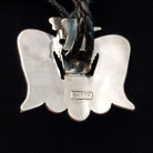 Zuni Thunderbird Bolo Tie by Bobby Shack featuring a detailed silver thunderbird with colorful turquoise, coral red, white, and black geometric inlay, outstretched wings, braided black leather cord, and polished silver tips; artist stamp on back.