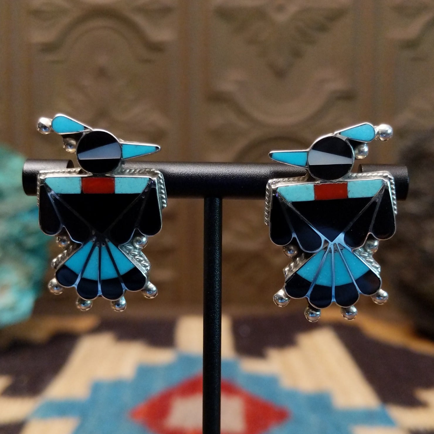 Sterling silver thunderbird earrings with multistone inlay.