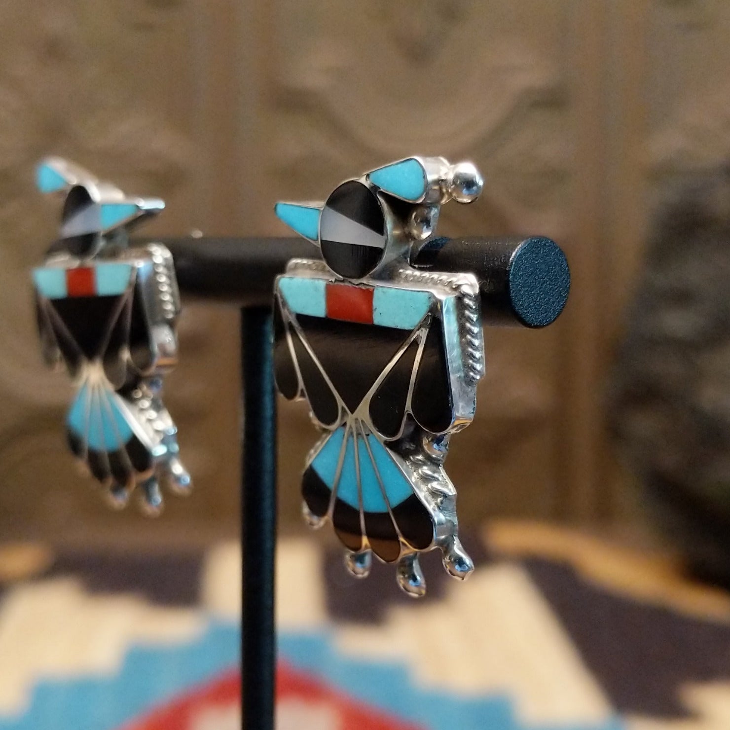Sterling silver thunderbird earrings with multistone inlay.