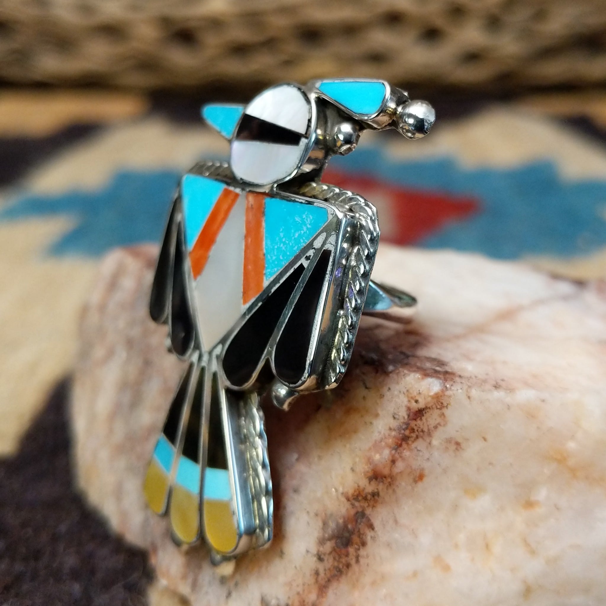 Zuni Thunderbird ring, featuring a handcrafted sterling silver Thunderbird design with intricate detailing and traditional Southwestern craftsmanship.  Side view.