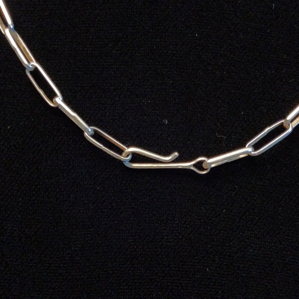 Close-up of the hook clasp on the necklace.