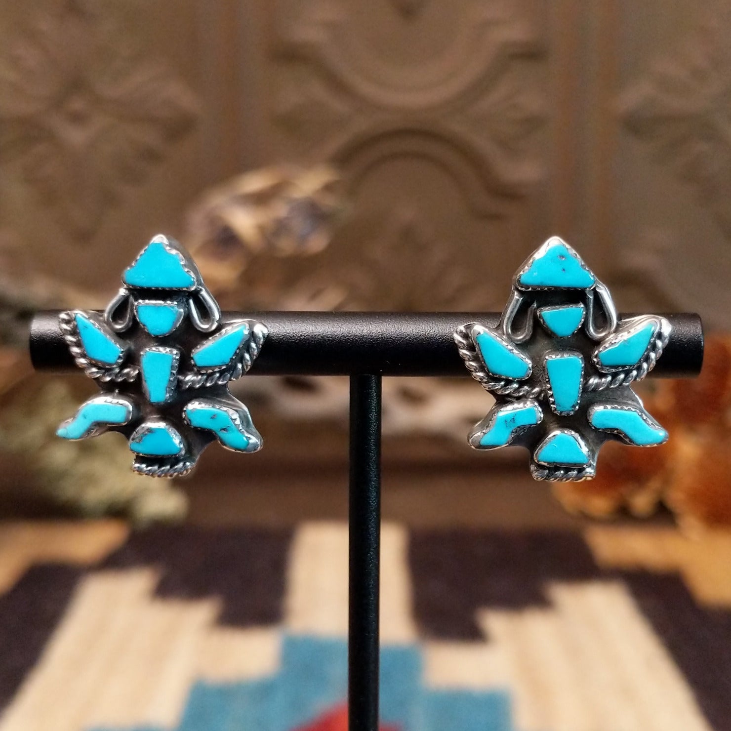 Sterling silver earrings with turquoise set in the dancer bezels.