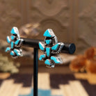 Sterling silver earrings with turquoise set in the dancer bezels.