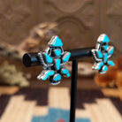 Sterling silver earrings with turquoise set in the dancer bezels.