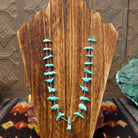 Necklace displays Zuni turquoise fetish carvings of various animals with heishi beads.