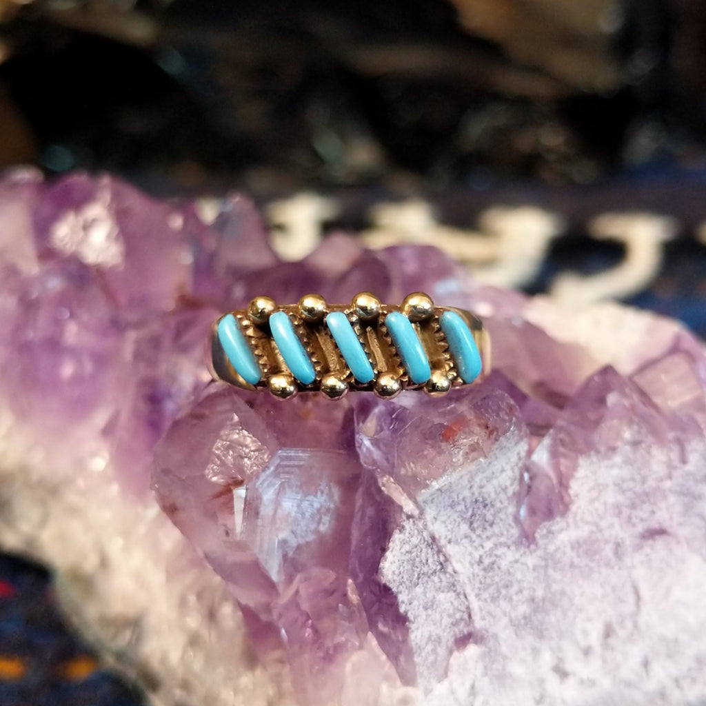Turquoise inlay ring with seven diagonal turquoise and beaded gold detailing.