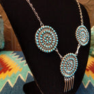 Turquoise petit point necklace set in sterling silver.