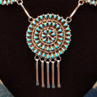 Turquoise petit point necklace set in sterling silver.