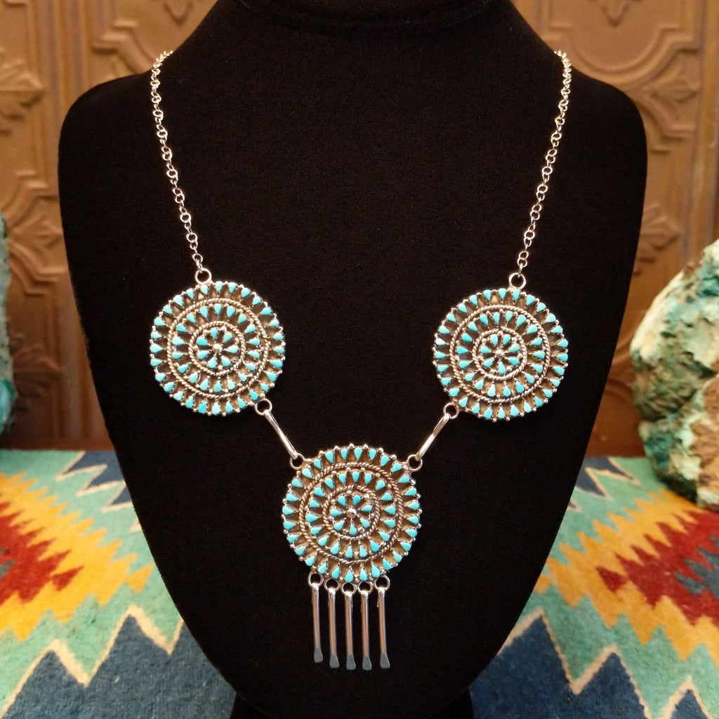 Turquoise petit point necklace set in sterling silver.