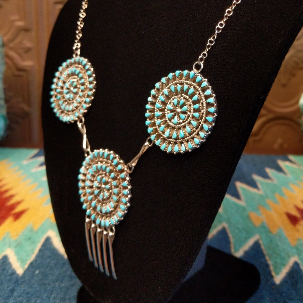 Turquoise petit point necklace set in sterling silver.