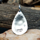 Close-up of the artisan's stamped signature.