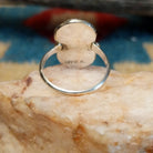Sterling silver ring with turquoise set in the bezel and snake motif.