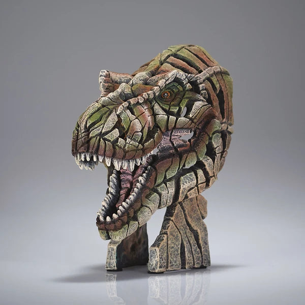 T-rex head sculpture with a camouflage pattern on a gray background