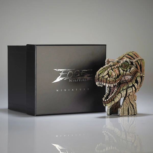 T-rex head sculpture in front of a black box with 'Edge Sculpture' branding.