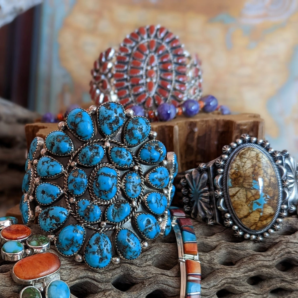 collection of native american made sterling silver and various turquoises and coral jewelry pieces