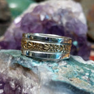 Silver and 14K gold stamped ring by Marc Antia, featuring hand-stamped geometric patterns, gold accents, and a polished sterling silver band.