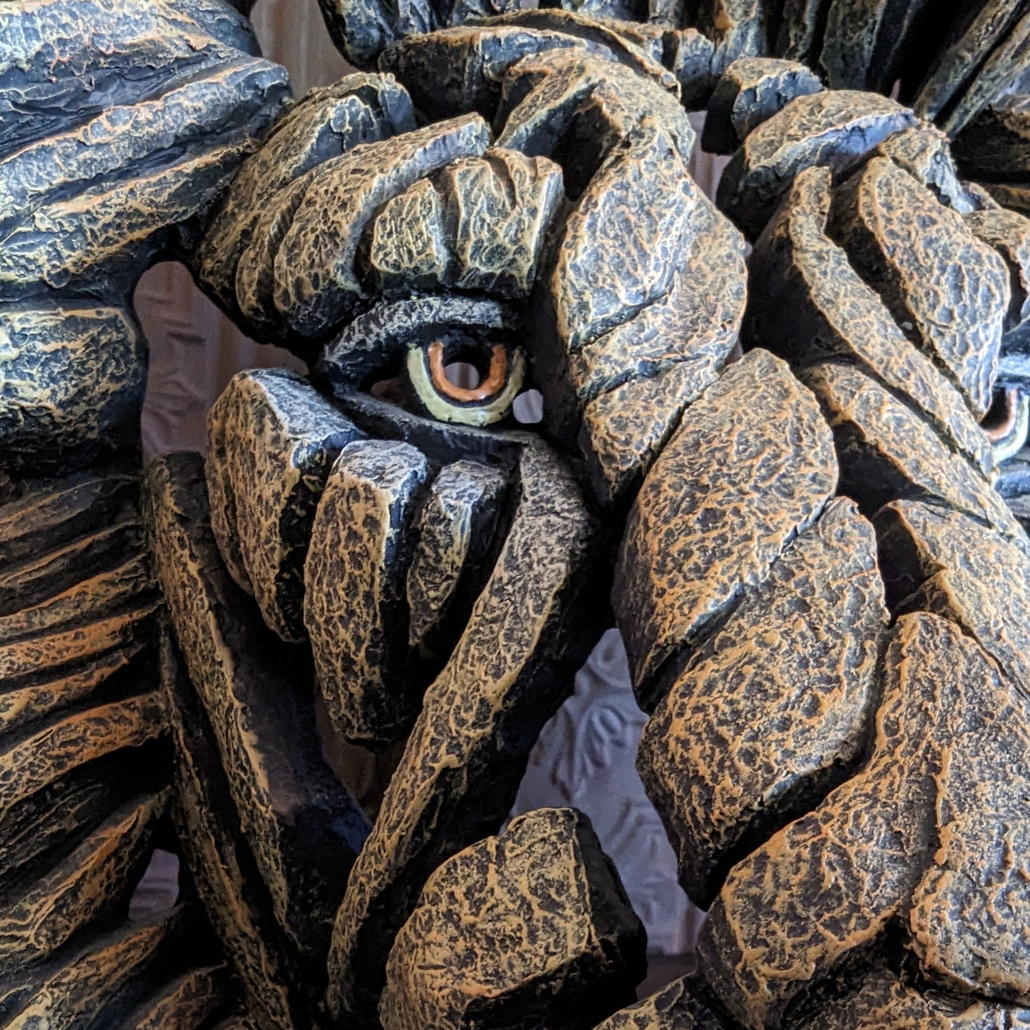edge sculpture lion head close up front view