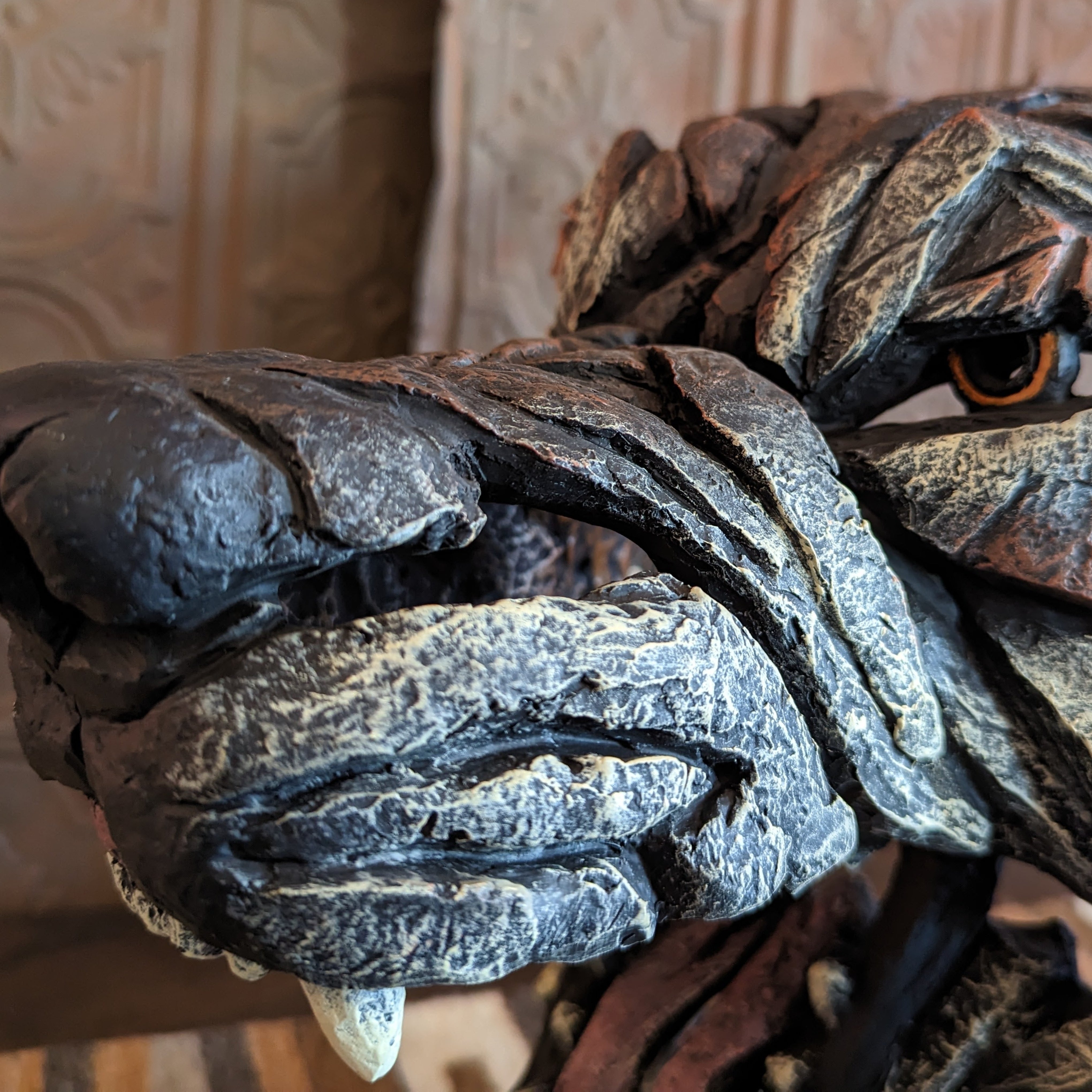 edge wolf sculpture left side closeup